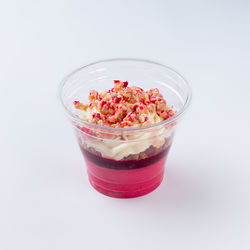 Close-up of strawberries on glass against white background