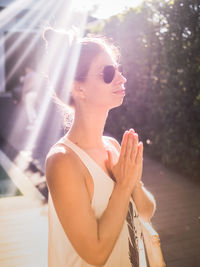 Close-up of young woman standing outdoors