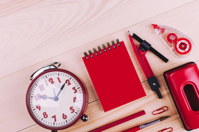 High angle view of clock on table