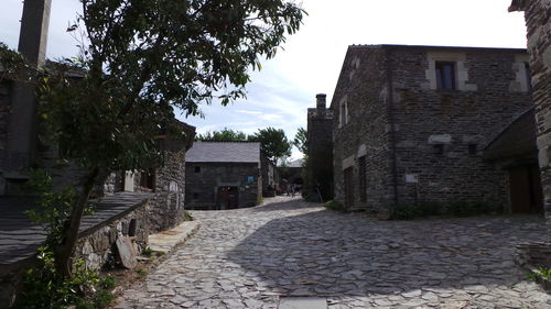 Narrow walkway leading to narrow alley