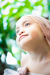 Close-up of cute girl looking away