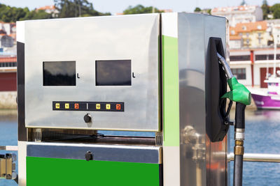 Close-up of fuel pump by sea