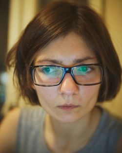 Close-up of thoughtful woman at home