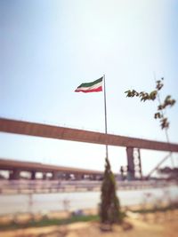 Low angle view of flag against clear sky