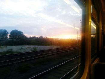 Sunset seen through train windshield