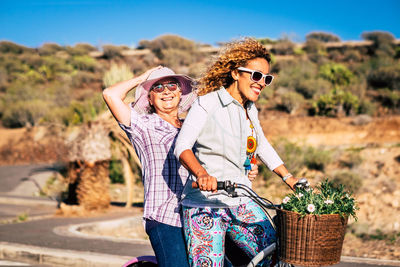 Cheerful women on bicycle 