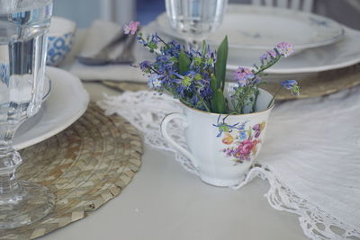 Close-up of flowers in cup on table