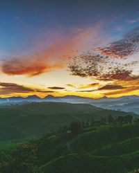 Scenic view of landscape against sky during sunset