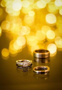 Close-up of wedding rings on table