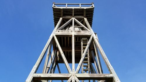 Low angle view of tower against clear blue sky