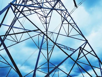 Low angle view of electricity pylon against sky