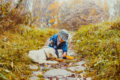 Man with dog in autumn