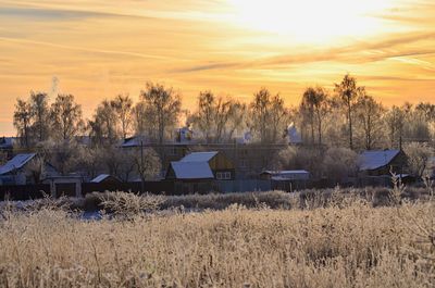 Scenic view of field against sky during sunset