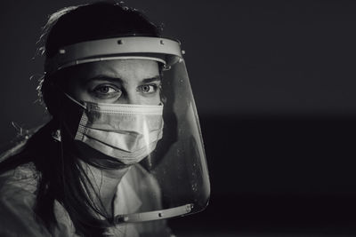Female doctor with face shield and face mask