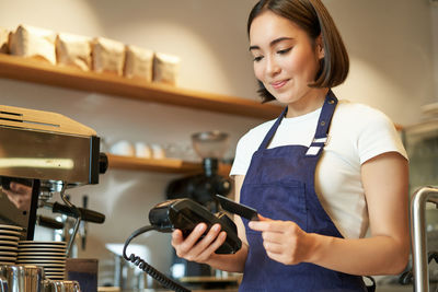 Young woman using mobile phone