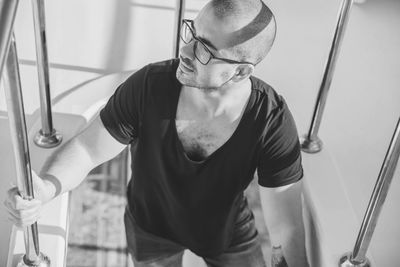 Low angle view of young man standing in gym