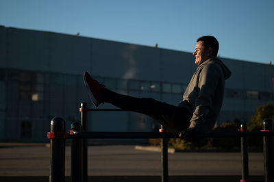 Side view of businessman using mobile phone