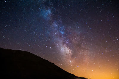 Low angle view of stars in sky at night