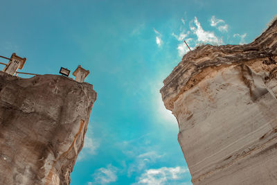Low angle view of rock formation against sky