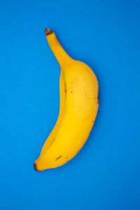 Close-up of yellow slice against blue background