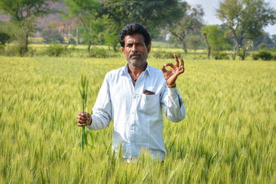 Indian farmer at wheat field