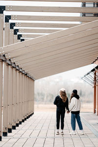 Low angle view of people walking on staircase