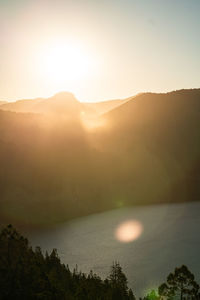 Scenic view of mountains against sky during sunset