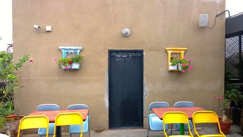 Empty chairs and tables at outdoor cafe