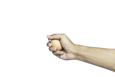 Close-up of human hand against white background
