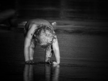 Full length of woman dancing in water