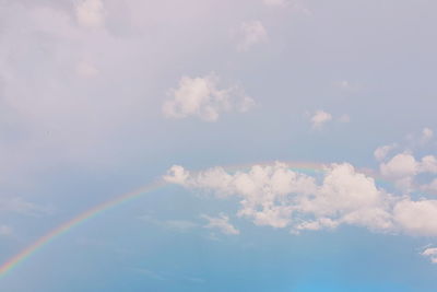 Low angle view of rainbow in sky