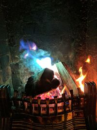 Illuminated bonfire against sky at night