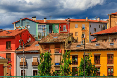 Buildings in city against sky