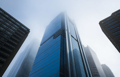 Low angle view of modern buildings against clear sky