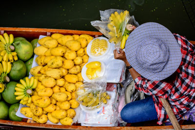 Man selling fruits on boat