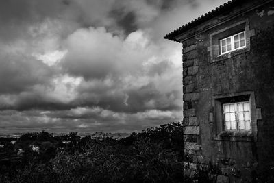 Built structure against cloudy sky