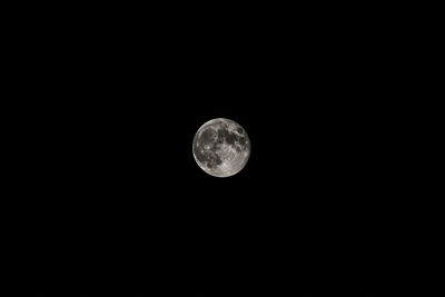 Low angle view of moon against sky at night