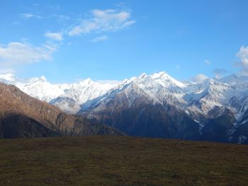 Scenic view of snowcapped mountains against sky