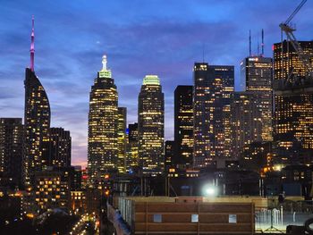 Illuminated buildings in city at night
