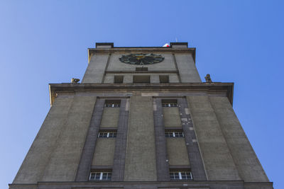 Low angle view of building against clear blue sky