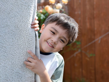 Portrait of boy playing with toy