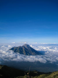 View of volcanic mountain against blue sky