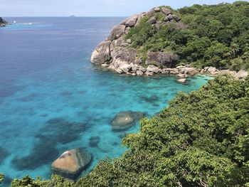 High angle view of rocks on beach against sky