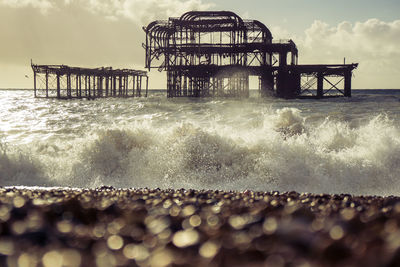 West pier amidst sea against sky