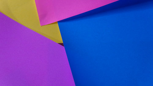 Close-up of paper boats against blue background