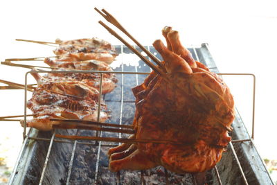 Close-up of meat on barbecue grill