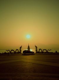 Silhouette people at sunset