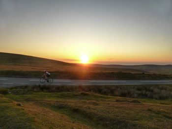 Scenic view of landscape at sunset