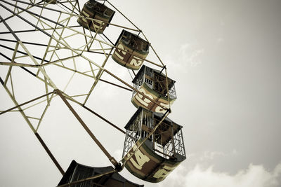 Low angle view of ferris wheel against sky