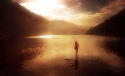 Scenic view of lake at sunset